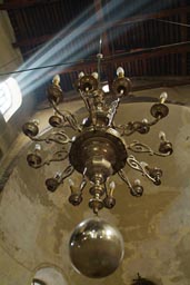 Sunlight enters the Church of Nativity, Bethlehem, candelabra.